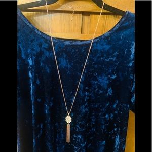 Women’s necklace - Gold chain with white bead and tassels.